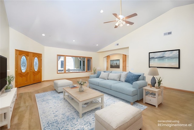 living room featuring high vaulted ceiling, ceiling fan, and light hardwood / wood-style flooring