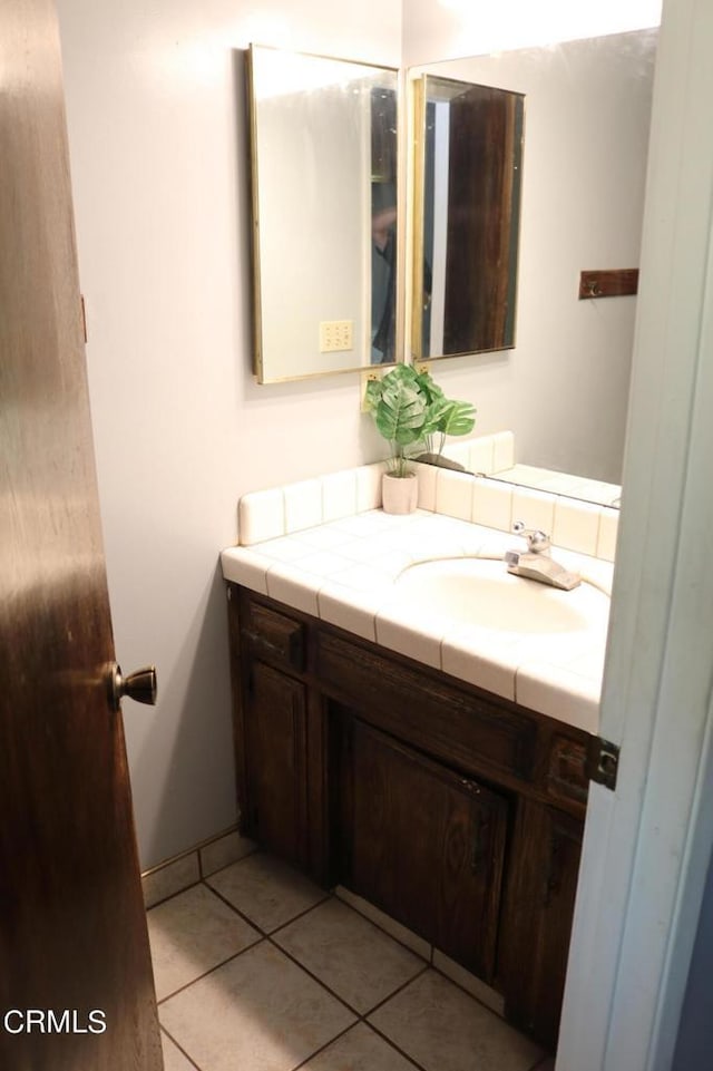 bathroom featuring tile patterned floors and vanity