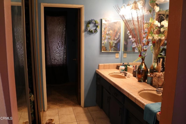 bathroom with tile patterned floors and vanity