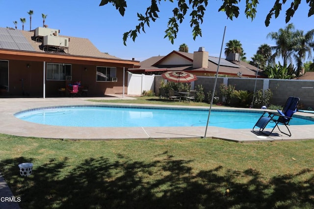 view of swimming pool with a patio area and central air condition unit