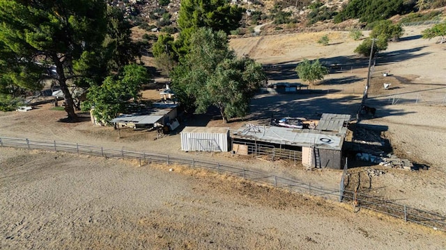 birds eye view of property featuring a rural view