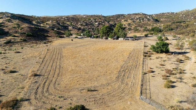 mountain view featuring a rural view