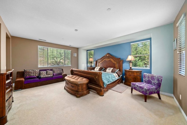 bedroom featuring light colored carpet