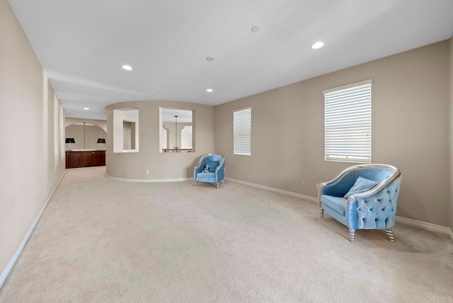 unfurnished room with light colored carpet