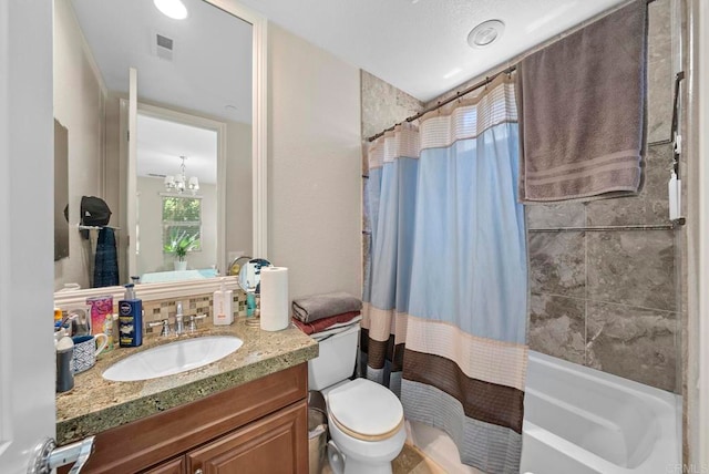 full bathroom with shower / bathtub combination with curtain, a notable chandelier, vanity, and toilet