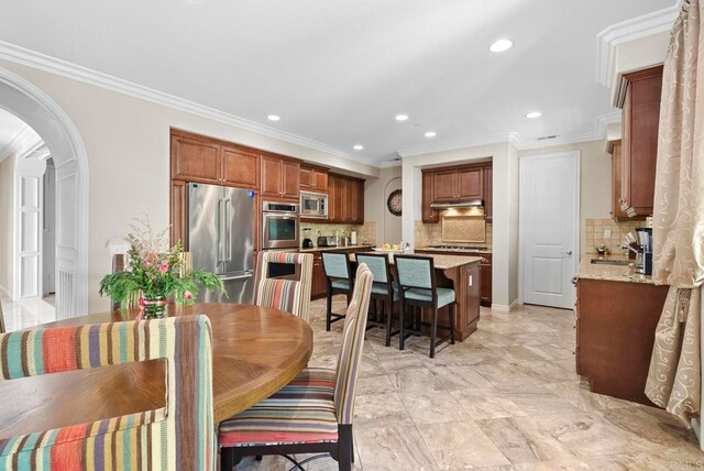 dining area featuring ornamental molding