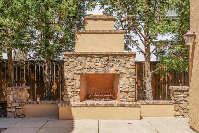 exterior space featuring a patio and exterior fireplace