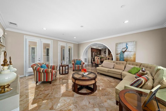 living room featuring french doors and crown molding