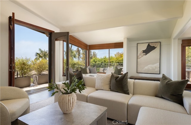 sunroom with beamed ceiling and a wealth of natural light