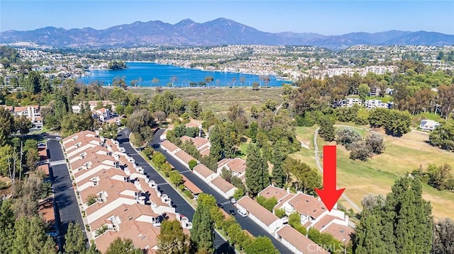 bird's eye view with a water and mountain view