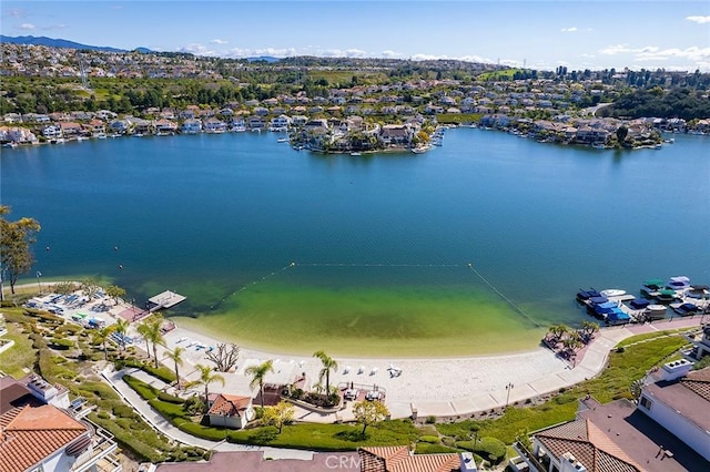 aerial view with a water view and a view of the beach