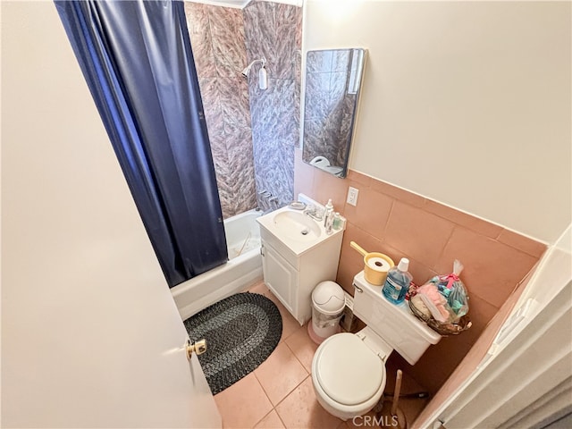 full bathroom featuring tile walls, vanity, shower / bath combination with curtain, tile patterned flooring, and toilet