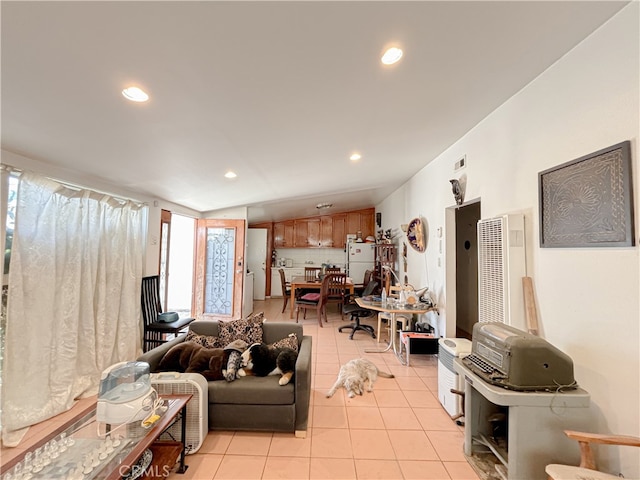 tiled living room featuring vaulted ceiling