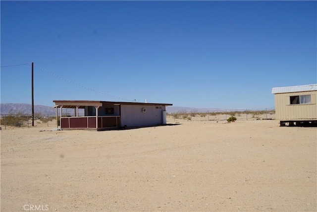 exterior space with a mountain view and a rural view