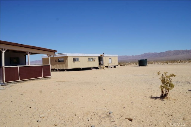 back of house featuring a mountain view