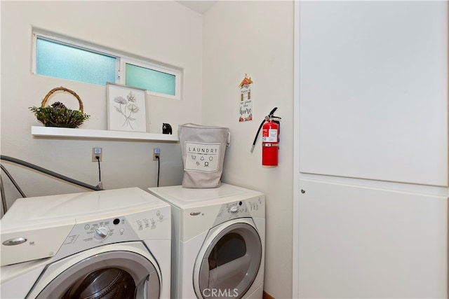 laundry area featuring washing machine and clothes dryer