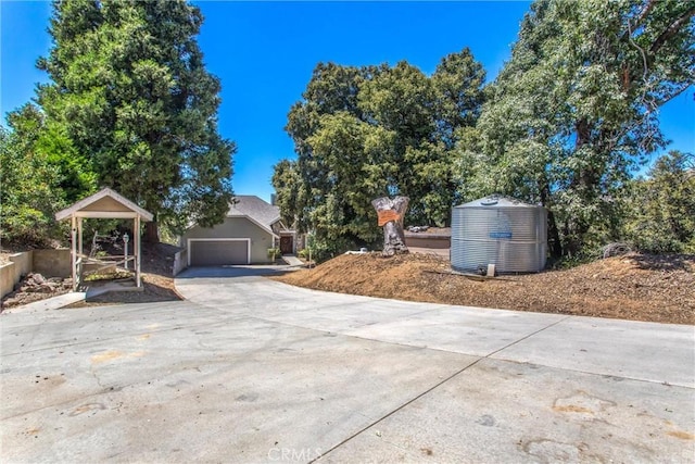 exterior space with a garage and concrete driveway