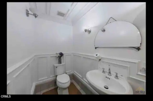 bathroom with toilet and sink