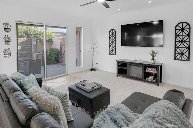 carpeted living room featuring ceiling fan