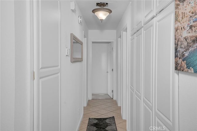 hallway featuring light tile patterned floors