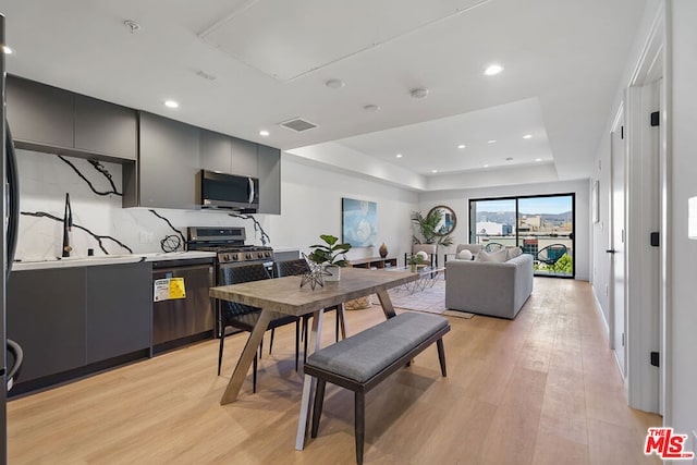 dining area featuring light wood-type flooring