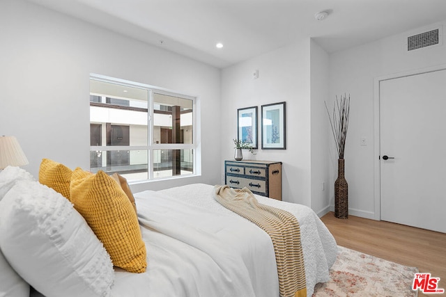 bedroom with light wood-type flooring