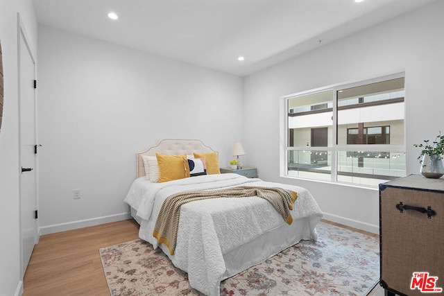 bedroom with light hardwood / wood-style floors