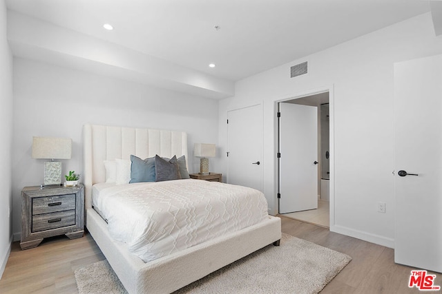 bedroom featuring light hardwood / wood-style flooring