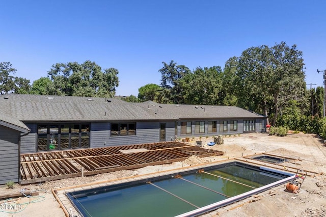 view of pool with a patio area and a hot tub