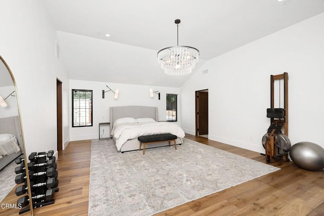 bedroom featuring wood-type flooring and lofted ceiling