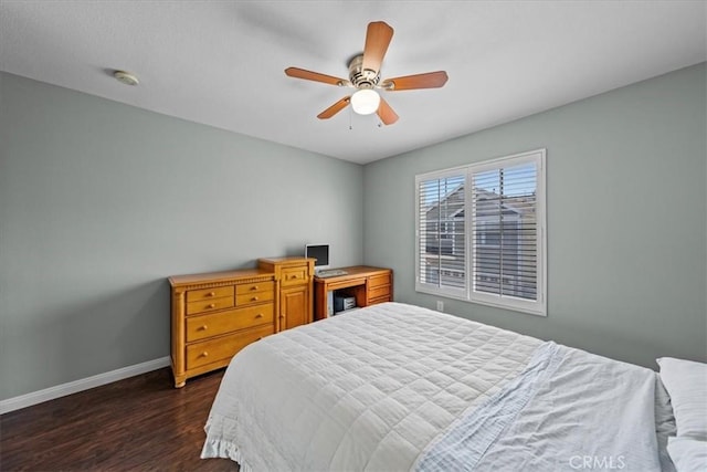 bedroom with ceiling fan and dark hardwood / wood-style flooring