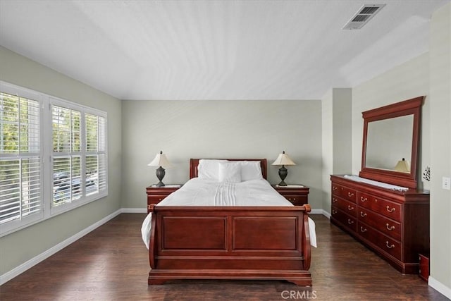 bedroom featuring dark hardwood / wood-style flooring