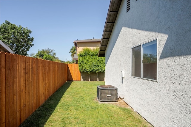 view of yard featuring central air condition unit