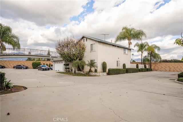 view of property exterior featuring a garage