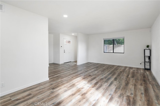 empty room with dark wood-type flooring