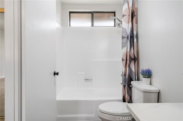 full bathroom with vanity, shower / bath combo with shower curtain, and toilet