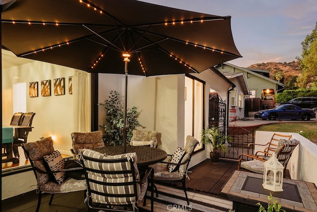 view of patio terrace at dusk