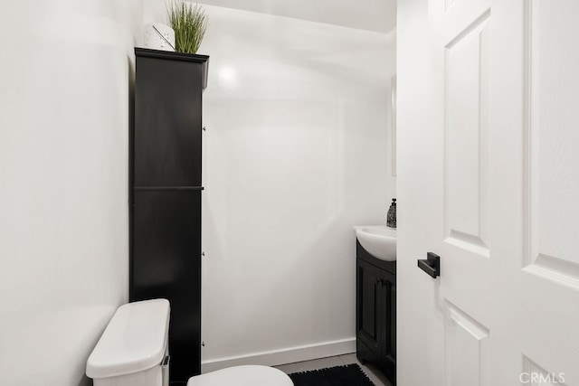 bathroom with vanity, toilet, and tile patterned floors