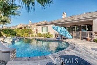 view of pool featuring a patio area