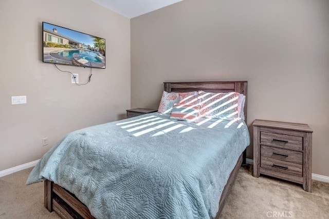 bedroom with light colored carpet