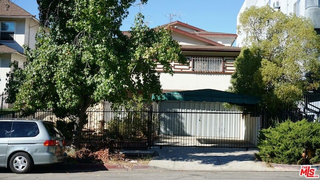 obstructed view of property featuring a garage