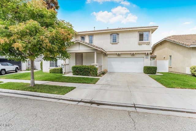 view of front of house featuring a front yard and a garage