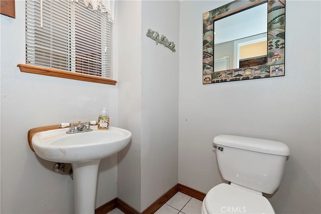 bathroom featuring toilet and tile patterned floors