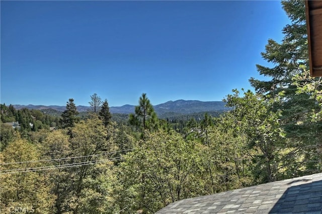 property view of mountains with a wooded view