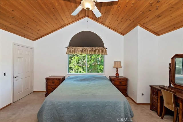 bedroom with lofted ceiling, multiple windows, and carpet