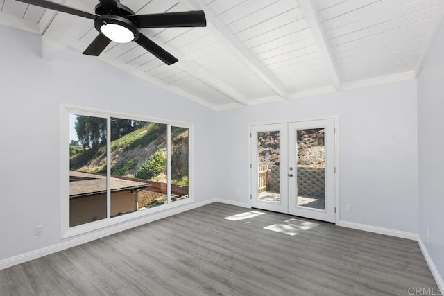 spare room featuring hardwood / wood-style flooring, vaulted ceiling with beams, ceiling fan, and french doors