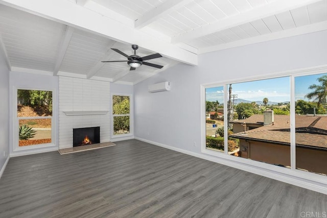 living room featuring dark hardwood / wood-style flooring, ceiling fan, an AC wall unit, a fireplace, and vaulted ceiling with beams