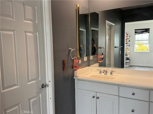 bathroom featuring vanity and a textured ceiling