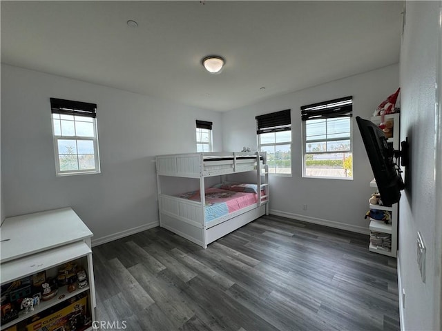 unfurnished bedroom with dark hardwood / wood-style floors