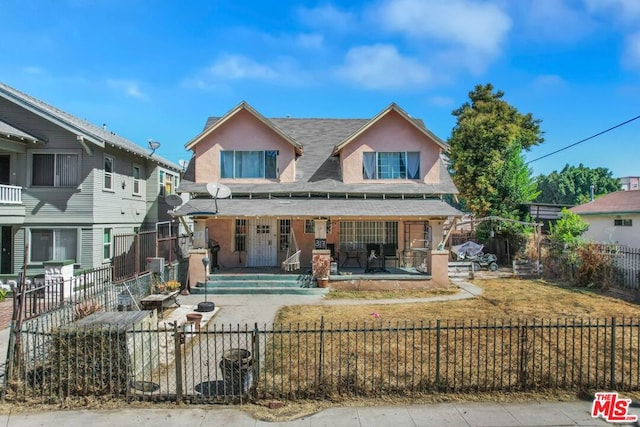 view of front of property with a patio and french doors